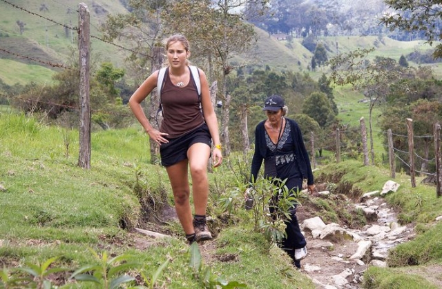  two girls walking through the mountains 